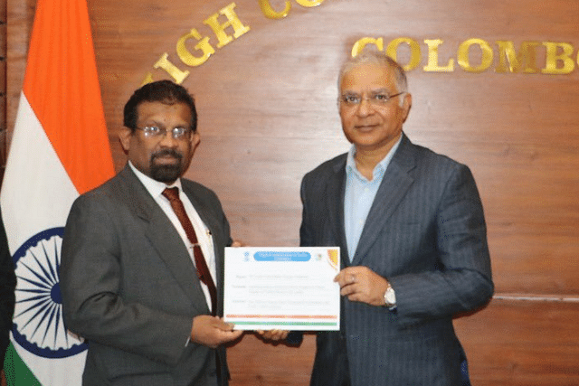 Indian High Commissioner Santosh Jha handed over 1st payment for Hybrid Power Projects to Sri Lankan Power Minister secretary Sulakshana Jayawardena